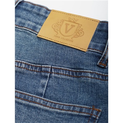 Джинсы клеш от колена из эластичного денима