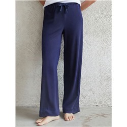 Прямые брюки с поясом на резинке из фактурного трикотажа в рубчик