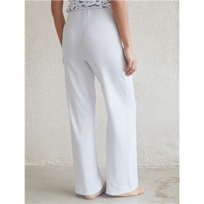 Прямые брюки с поясом на резинке из фактурного трикотажа в рубчик