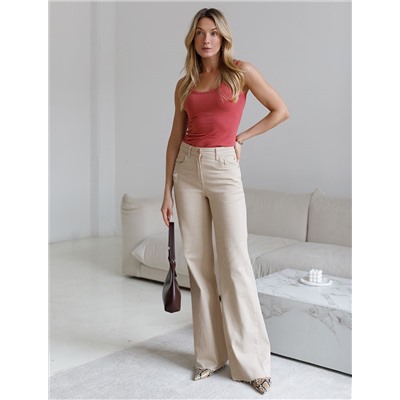 Джинсы клеш с прорезями и с необработанным краем из эластичного денима средней плотности