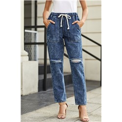 Темно-синие джинсы-джоггеры на шнурке с карманами и потертостями