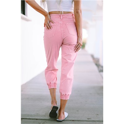 Розовые укороченные джинсы со стиркой и эластичными манжетами