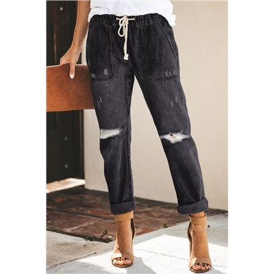 Черные джинсы-джоггеры на шнурке с карманами и потертостями