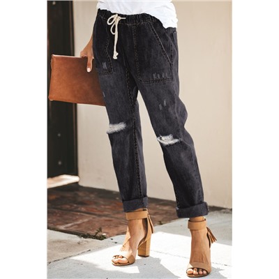 Черные джинсы-джоггеры на шнурке с карманами и потертостями
